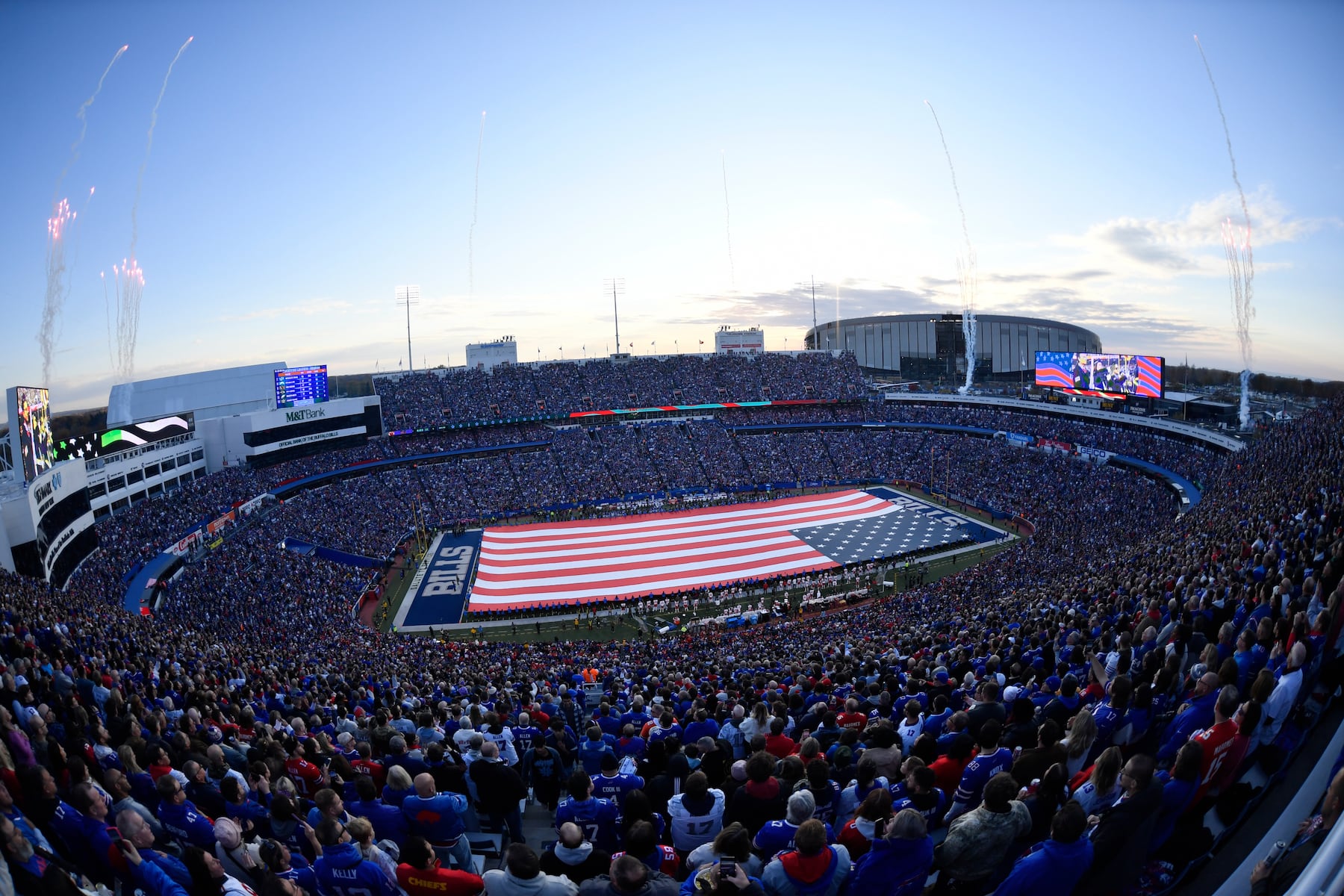 Fans watch as the United States flag is unfurled in this general view of Highmark Stadium before an NFL football game runs with the between the Kansas City Chiefs and the Buffalo Bills Sunday, Nov. 2, 2025, in Orchard Park. N.Y. (AP Photo/Adrian Kraus)