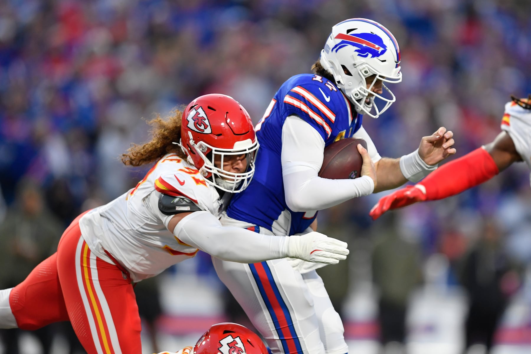 Buffalo Bills quarterback Josh Allen, right, is tackled by Kansas City Chiefs defensive end Ashton Gillotte during the first half of an NFL football game Sunday, Nov. 2, 2025, in Orchard Park. N.Y. (AP Photo/Adrian Kraus)