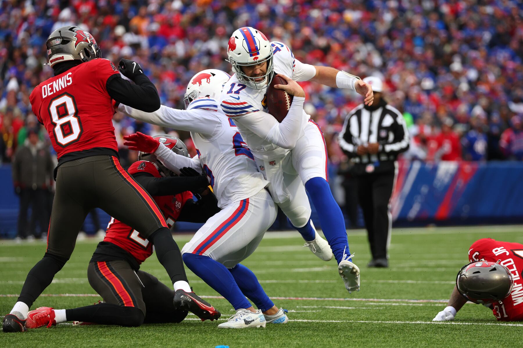 Buffalo Bills quarterback Josh Allen (17) runs against the Tampa Bay Buccaneers during the first half of an NFL football game, Sunday, Nov. 16, 2025, in Orchard Park, N.Y. (AP Photo/Jeffrey T. Barnes)