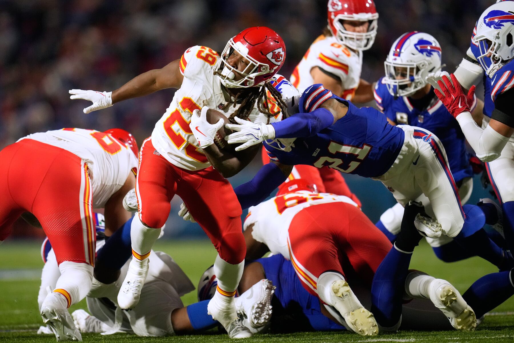 Kansas City Chiefs running back Kareem Hunt (29) runs with the ball as Buffalo Bills safety Jordan Poyer (21) defends during the second half of an NFL football game Sunday, Nov. 2, 2025, in Orchard Park. N.Y. (AP Photo/Sue Ogrocki)