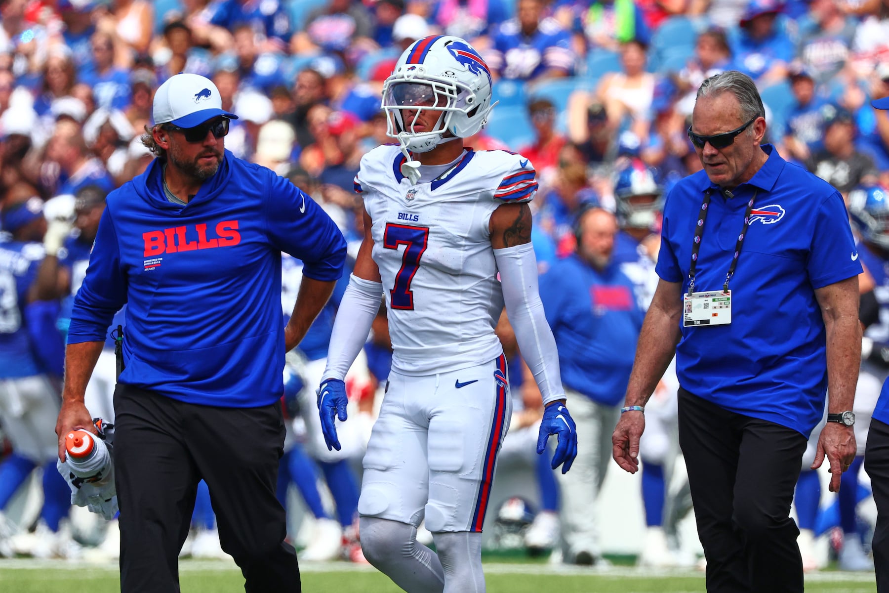 Buffalo Bills cornerback Taron Johnson (7) is helped off the field during the first half of an NFL preseason football game against the New York Giants Saturday, Aug. 9, 2025, in Orchard Park, N.Y. (AP Photo/Jeffrey T. Barnes)