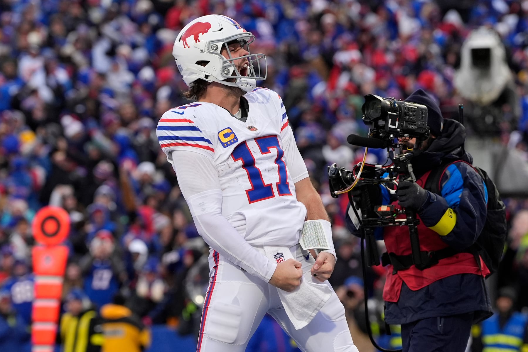 Buffalo Bills quarterback Josh Allen celebrates after scoring a touchdown against the Tampa Bay Buccaneers during the second half of an NFL football game, Sunday, Nov. 16, 2025, in Orchard Park, N.Y. (AP Photo/Carolyn Kaster)