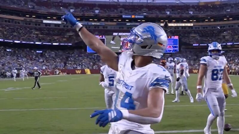 Amon-Ra St. Brown points to president Donald Trump