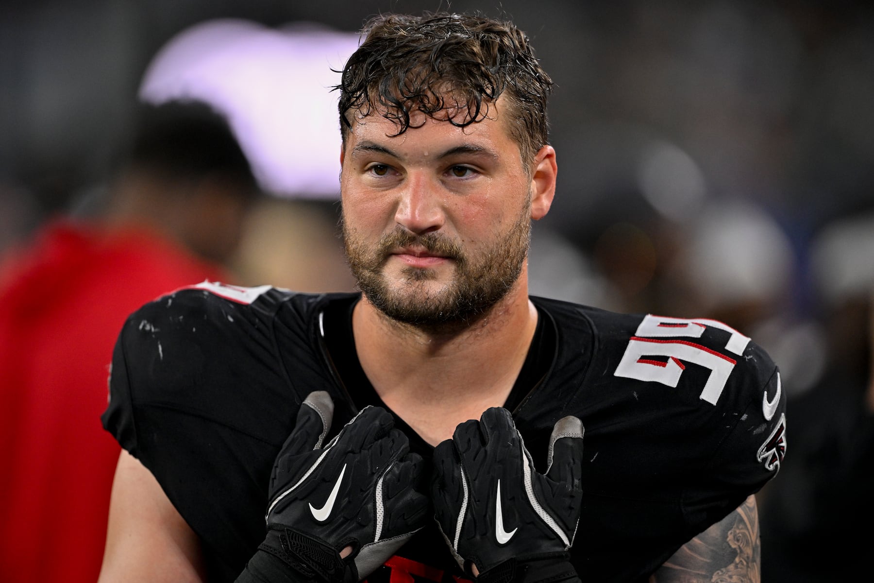 Atlanta Falcons defensive end Morgan Fox (99) walks the sidelines during a preseason NFL football game against the Dallas Cowboys, Friday, Aug. 22, 2025, in Arlington, Texas. (AP Photo/Jerome Miron)