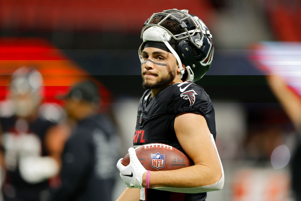 Drake London holding football