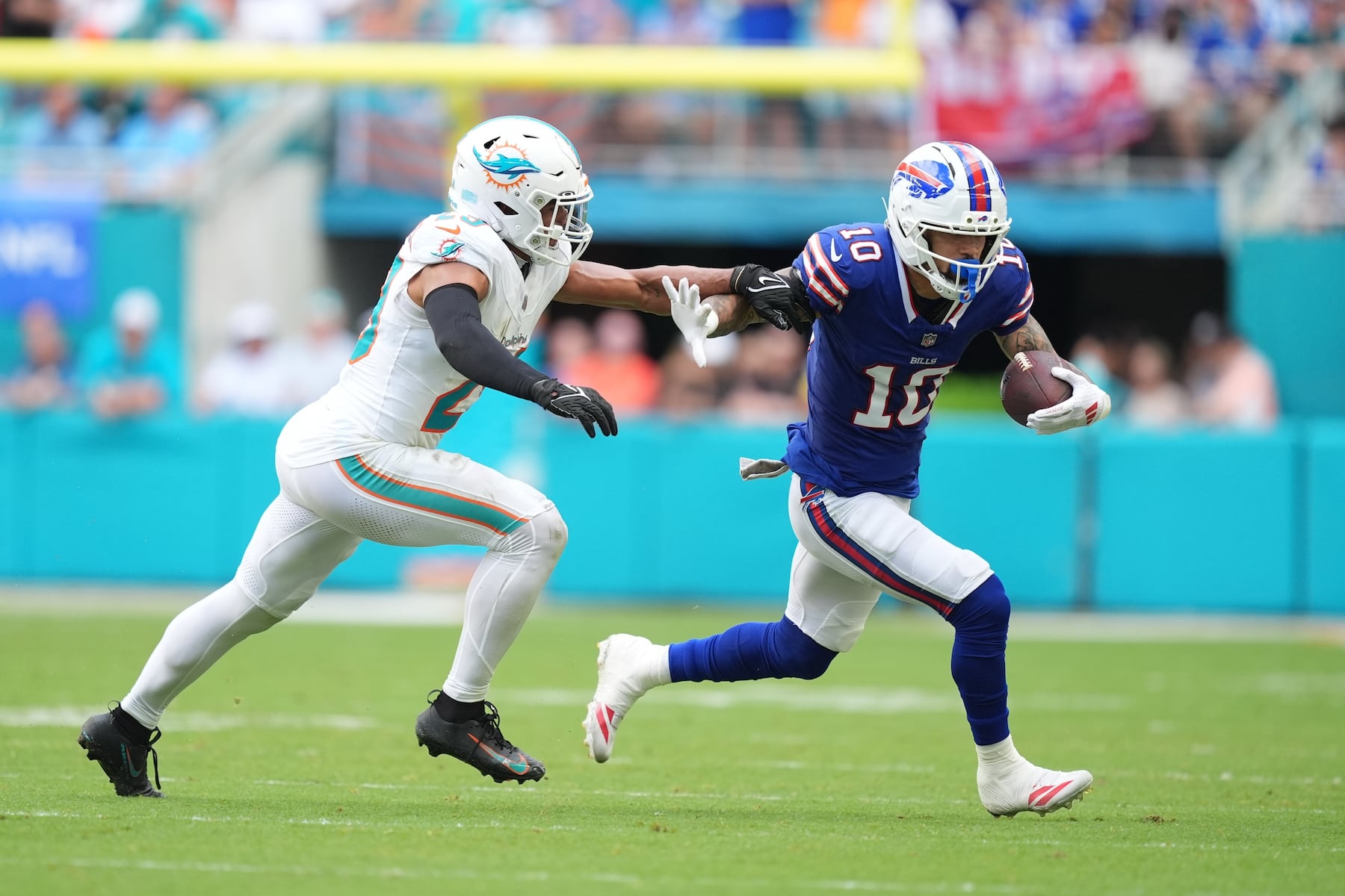 Buffalo Bills wide receiver Khalil Shakir (10) runs Miami Dolphins' Minkah Fitzpatrick against during the second half of an NFL football game, Sunday, Nov. 9, 2025, in Miami Gardens, Fla. (AP Photo/Rebecca Blackwell)