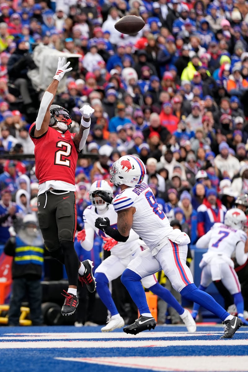 Tampa Bay Buccaneers wide receiver Emeka Egbuka (2) cannot make a catch against Buffalo Bills linebacker Terrel Bernard (8) during the first half of an NFL football game, Sunday, Nov. 16, 2025, in Orchard Park, N.Y. (AP Photo/Carolyn Kaster)