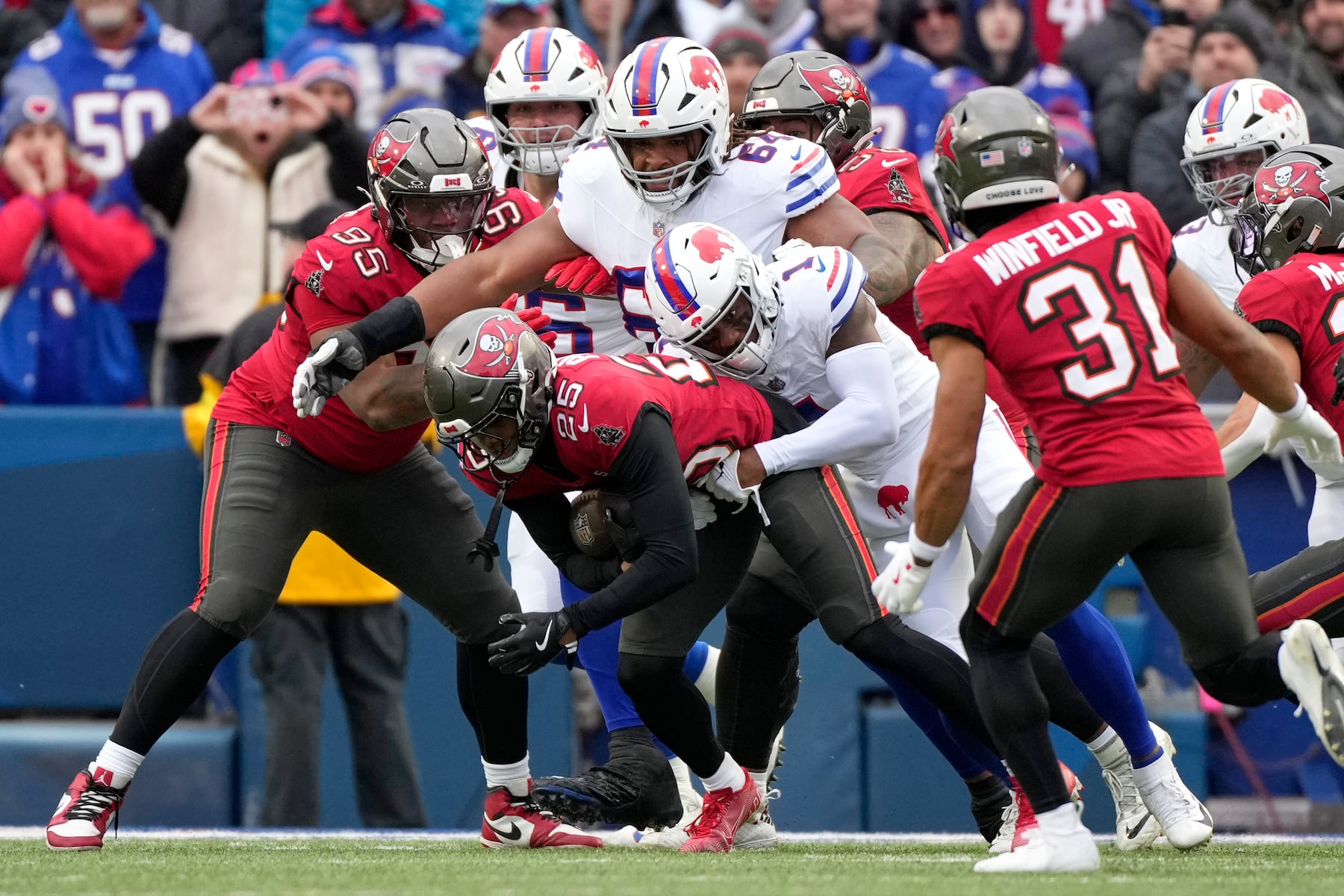 Tampa Bay Buccaneers cornerback Jacob Parrish (25) intercepts the ball against Buffalo Bills wide receiver Curtis Samuel (1) during the first half of an NFL football game, Sunday, Nov. 16, 2025, in Orchard Park, N.Y. (AP Photo/Carolyn Kaster)