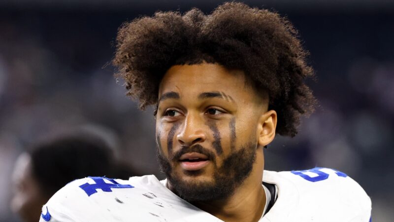 Marshawn Kneeland looks on