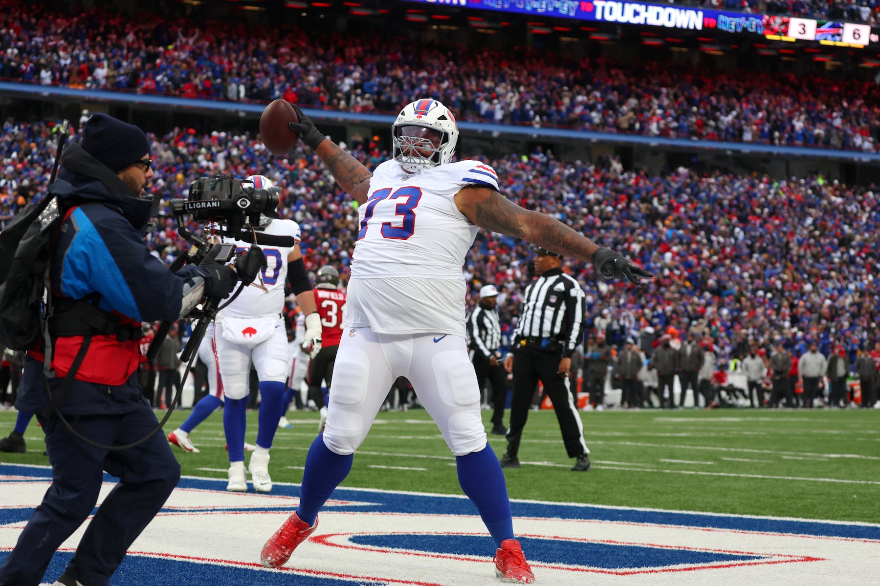 Buffalo Bills offensive tackle Dion Dawkins (73) celebrates after a touchdown by quarterback Josh Allen (17) during the first half of an NFL football game against the Tampa Bay Buccaneers, Sunday, Nov. 16, 2025, in Orchard Park, N.Y. (AP Photo/Jeffrey T. Barnes)