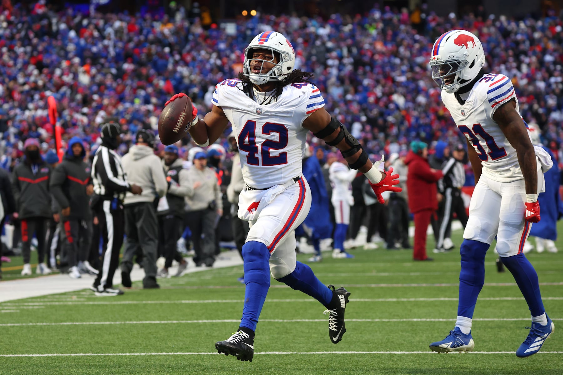 Buffalo Bills linebacker Dorian Williams (42) celebrates after a fumble recovery against the Tampa Bay Buccaneers during the second half of an NFL football game, Sunday, Nov. 16, 2025, in Orchard Park, N.Y. (AP Photo/Jeffrey T. Barnes)
