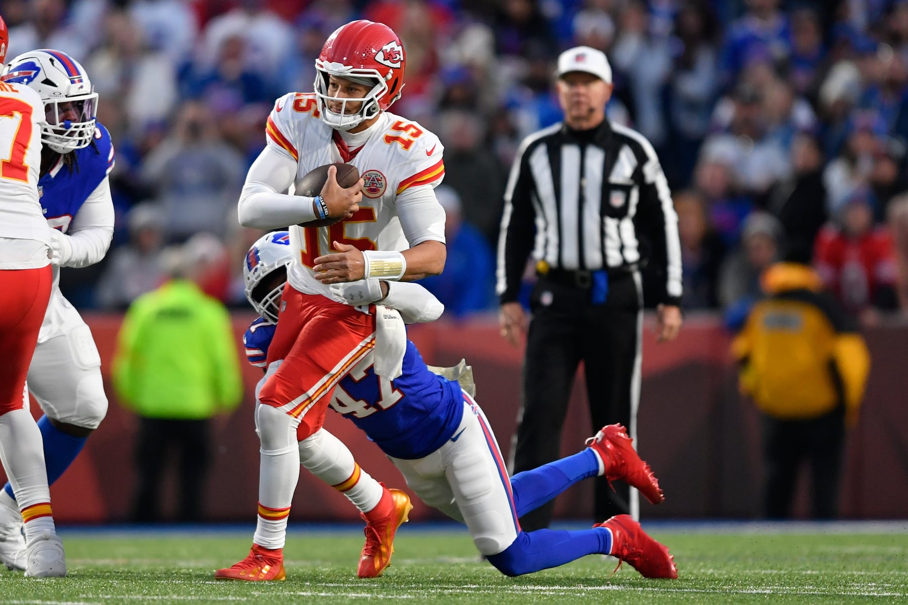 Kansas City Chiefs quarterback Patrick Mahomes (15) is sacked by Buffalo Bills cornerback Christian Benford (47) during the first half of an NFL football game Sunday, Nov. 2, 2025, in Orchard Park. N.Y. (AP Photo/Adrian Kraus)