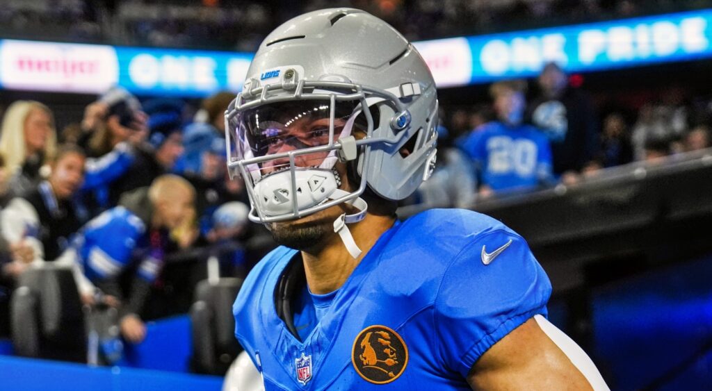 Amon-Ra St. Brown looking on.