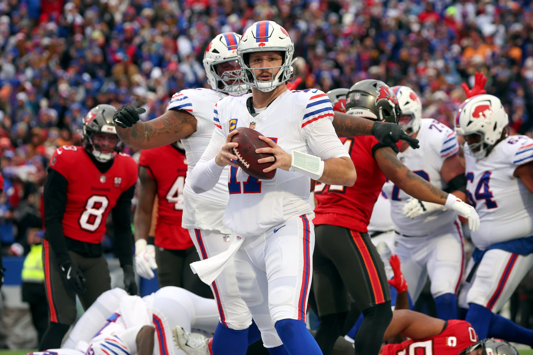 Buffalo Bills quarterback Josh Allen (17) reacts after scoring a touchdown against the Tampa Bay Buccaneers during the first half of an NFL football game, Sunday, Nov. 16, 2025, in Orchard Park, N.Y. (AP Photo/Jeffrey T. Barnes)