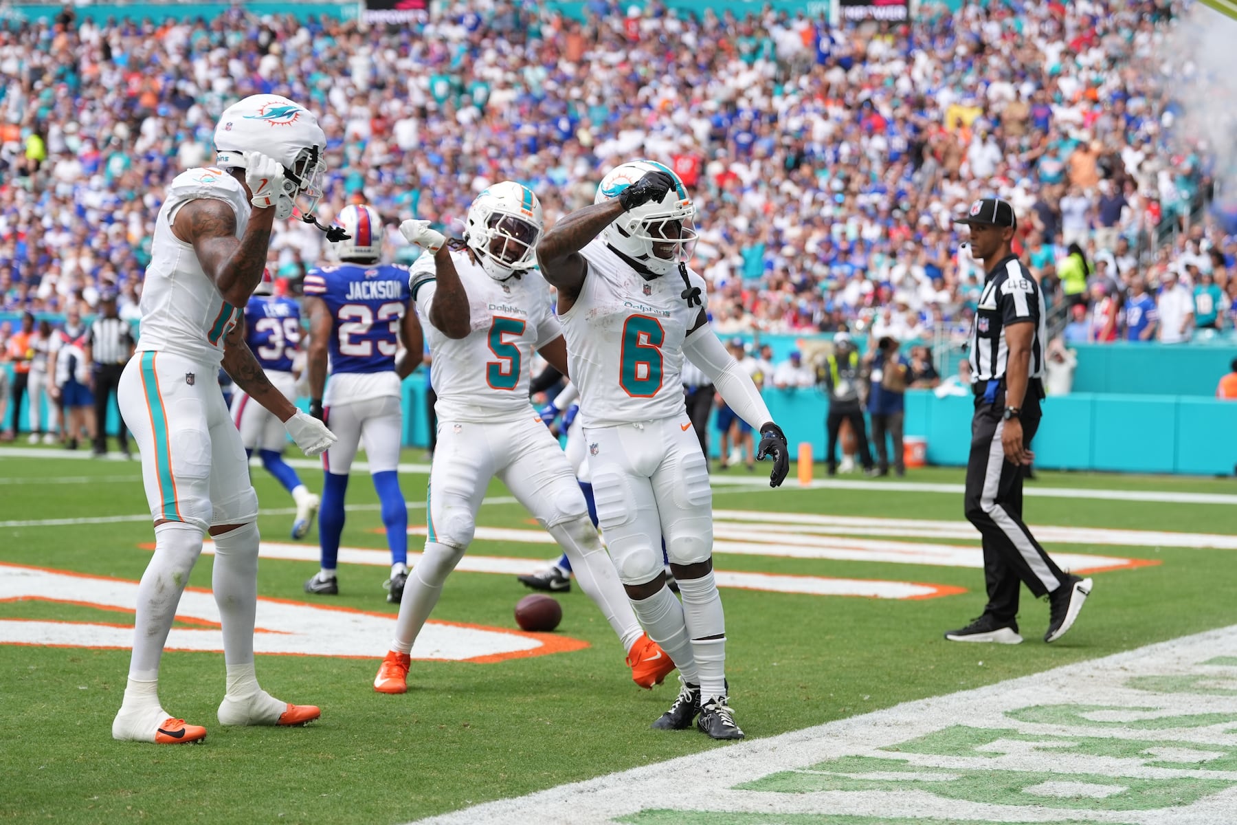 Miami Dolphins wide receiver Malik Washington (6) celebrates during the first half of an NFL football game against the Buffalo Bills, Sunday, Nov. 9, 2025, in Miami Gardens, Fla. (AP Photo/Rebecca Blackwell)