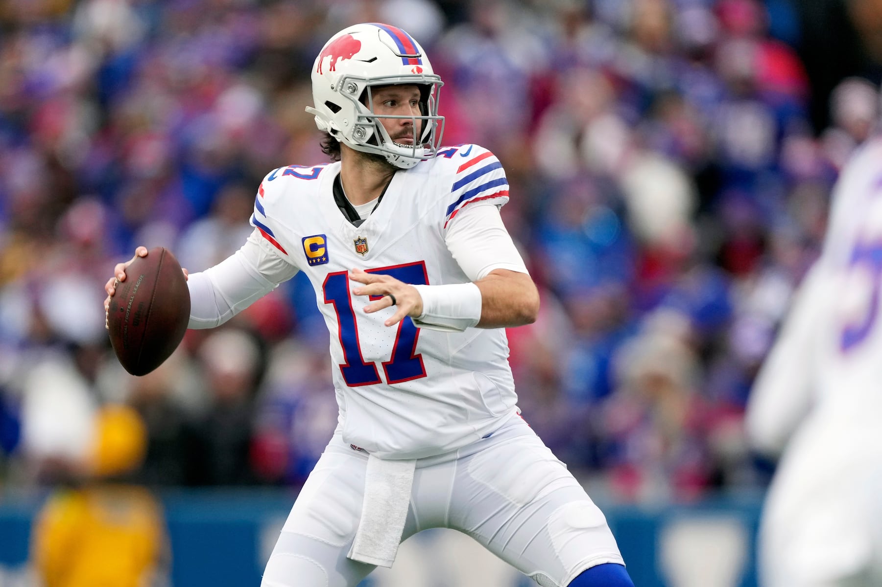 Buffalo Bills quarterback Josh Allen (17) looks to pass against the Tampa Bay Buccaneers during the first half of an NFL football game, Sunday, Nov. 16, 2025, in Orchard Park, N.Y. (AP Photo/Carolyn Kaster)