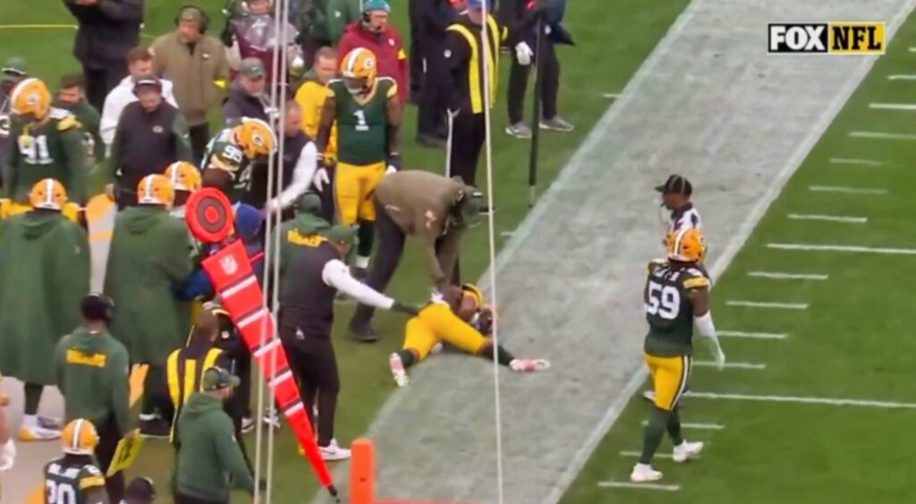 Keisean Nixon lying on sideline during Vikings-Packers game