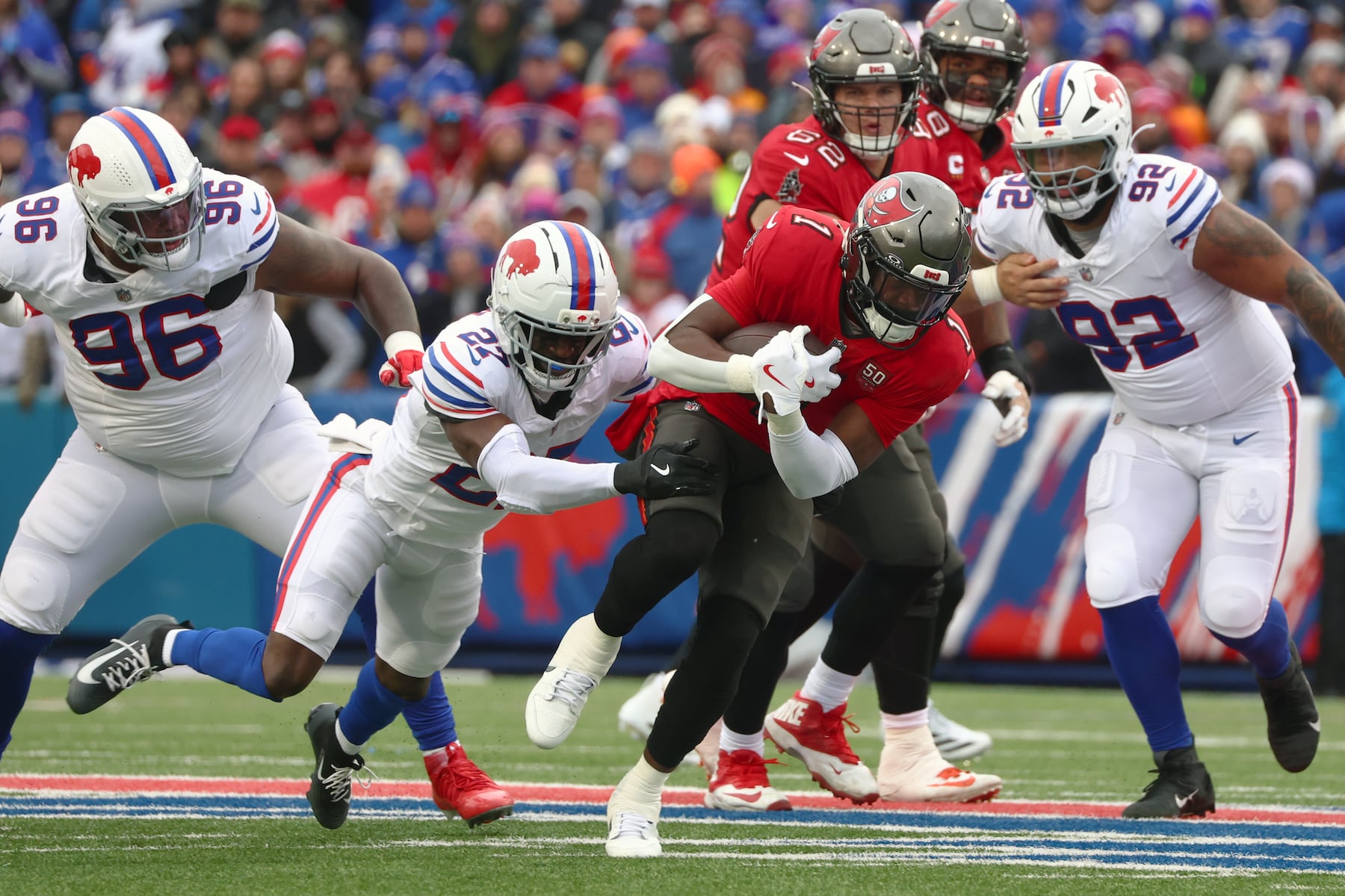 Tampa Bay Buccaneers running back Rachaad White (1) runs against Buffalo Bills cornerback Tre'Davious White (27) during the first half of an NFL football game, Sunday, Nov. 16, 2025, in Orchard Park, N.Y. (AP Photo/Jeffrey T. Barnes)