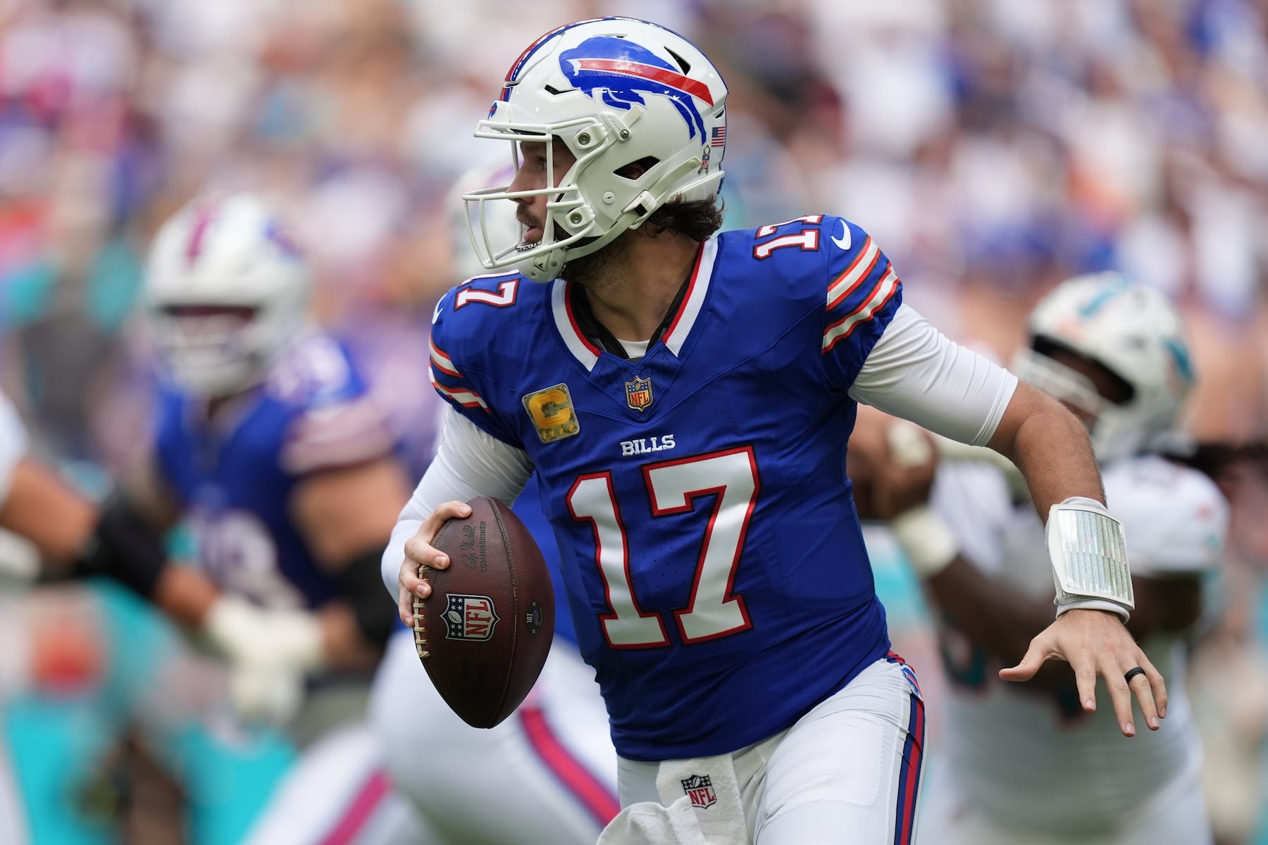 Buffalo Bills quarterback Josh Allen runs during the first half of an NFL football game against the Miami Dolphins, Sunday, Nov. 9, 2025, in Miami Gardens, Fla. (AP Photo/Rebecca Blackwell)