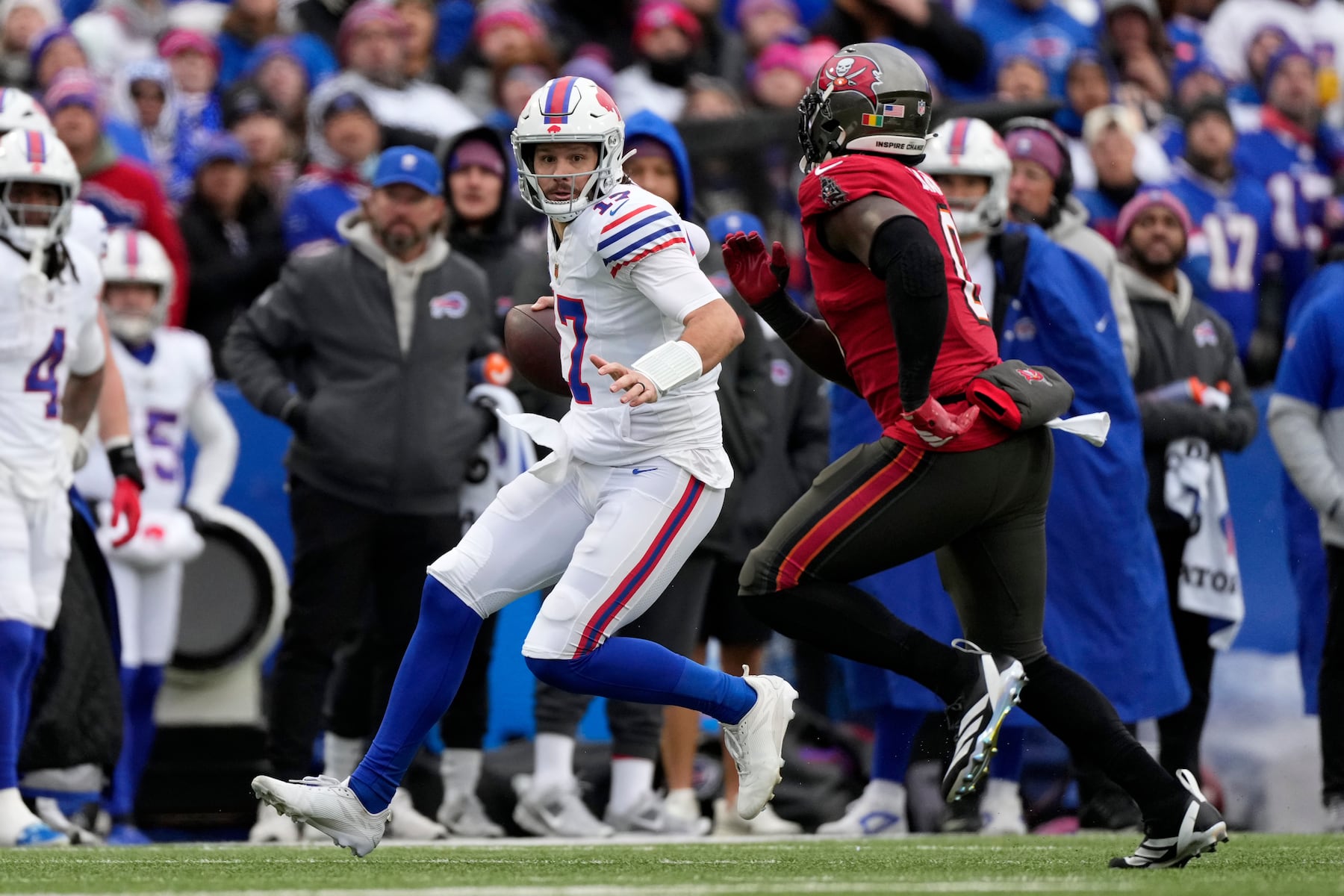 Buffalo Bills quarterback Josh Allen (17) runs against Tampa Bay Buccaneers linebacker Yaya Diaby (0) during the first half of an NFL football game, Sunday, Nov. 16, 2025, in Orchard Park, N.Y. (AP Photo/Carolyn Kaster)