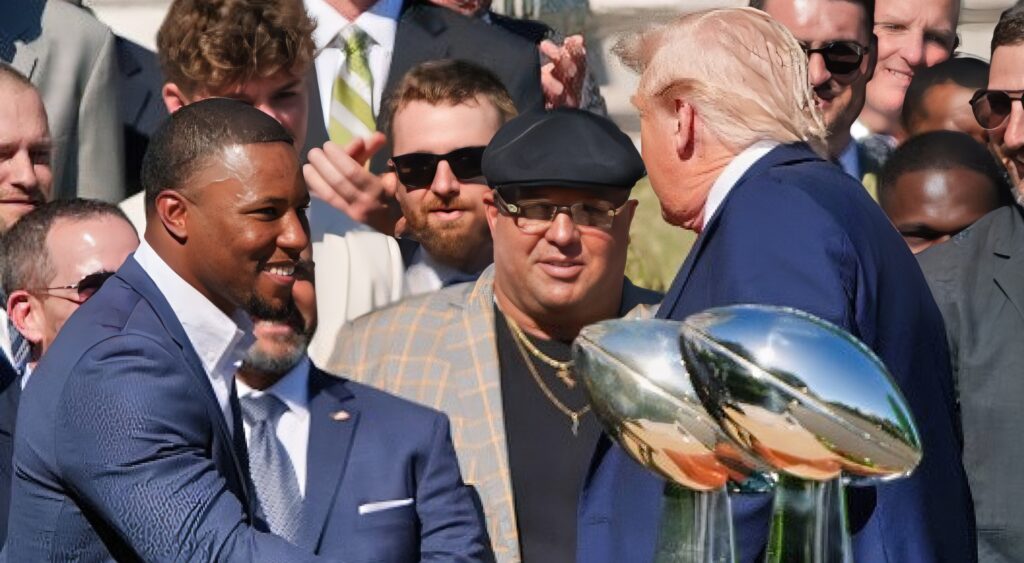 Saquon Barkley shaking hands with Donald Trump