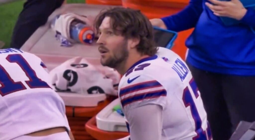 Josh Allen looking on.