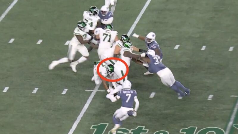 Justin Fields getting hit by a Jets teammate's butt