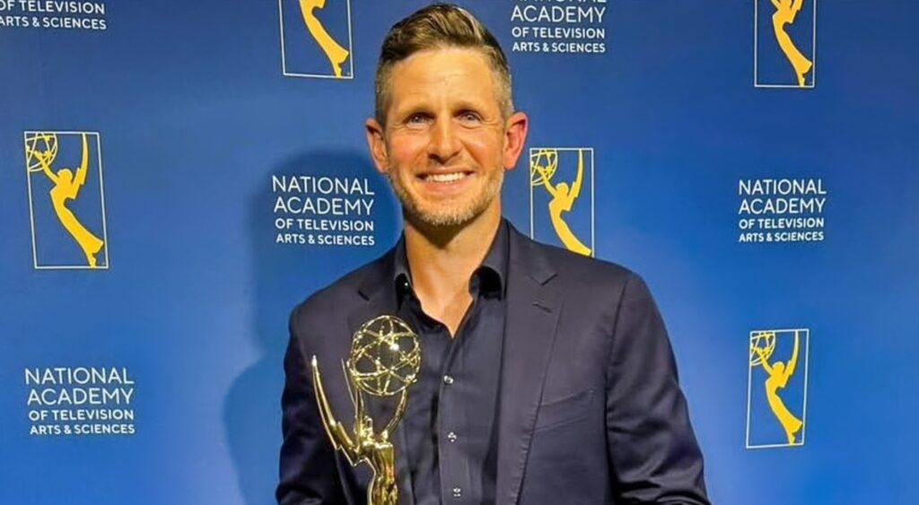 Dan Orlovsky holding award