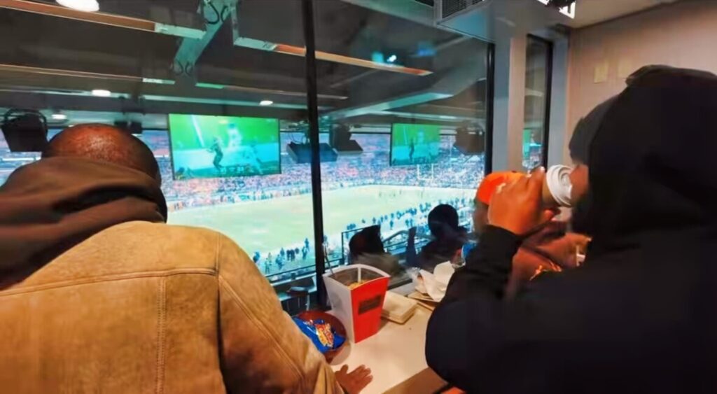 Deion Sanders in suite