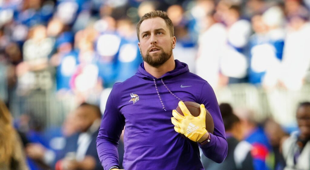 Adam Thielen holding a football