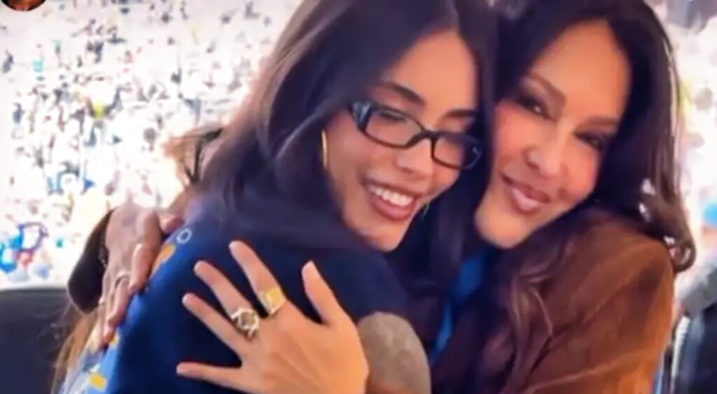 Madison Beer and her mother hugging.