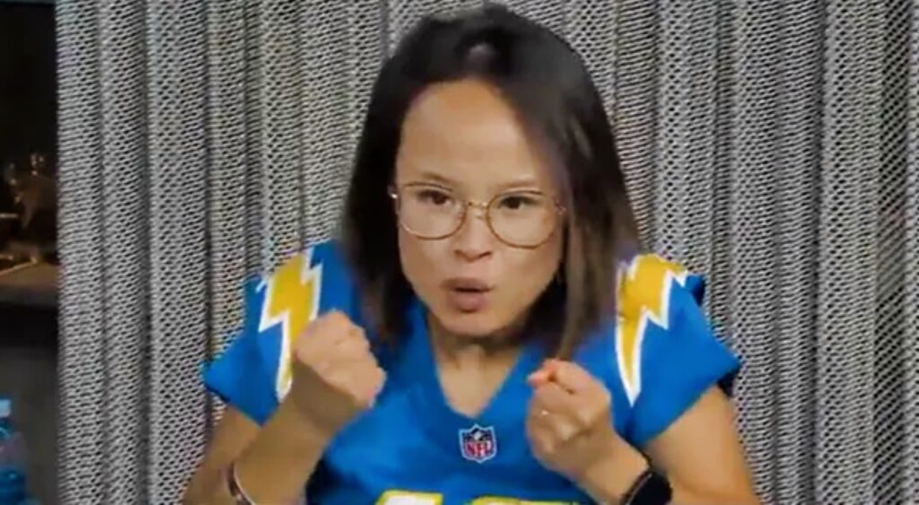 Merrianne Do cheering in the stands