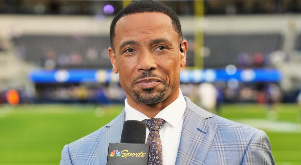 Rodney Harrison with microphone