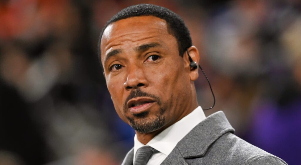 Rodney Harrison in a gray suit
