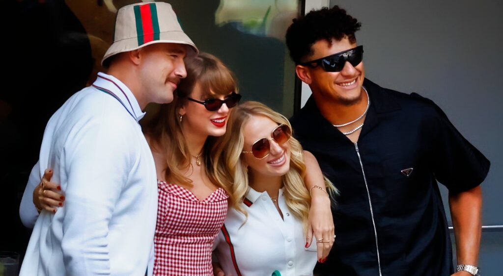 Travis Kelce, Taylor Swift, Brittany Mahomes, and Travis Kelce posing for photo