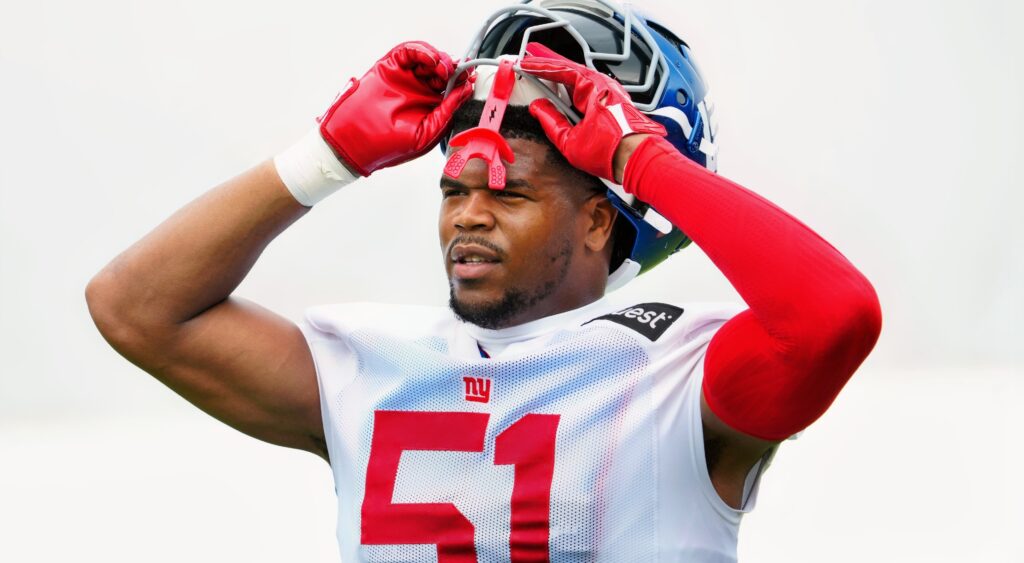 Abdul Carter removing his helmet