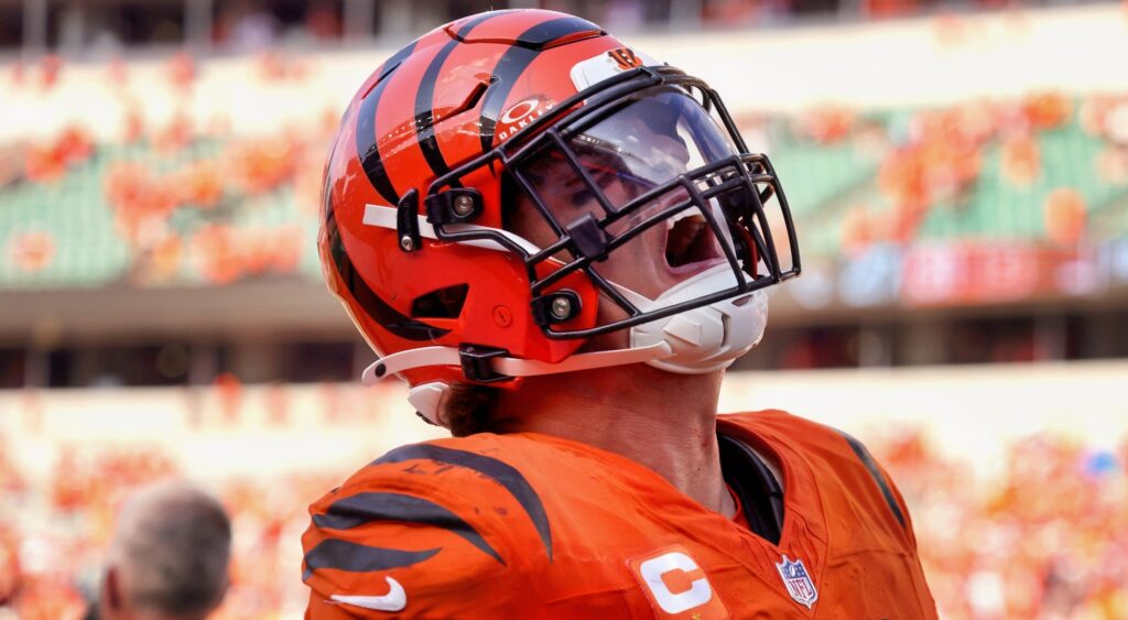 Trey Hendrickson looking on.