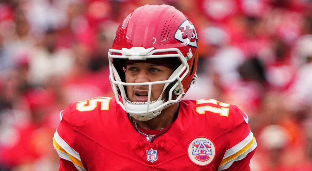 Patrick Mahomes looking on.