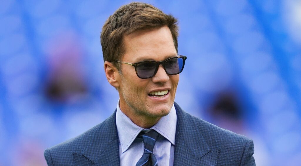 Tom Brady wearing suit and sunglasses