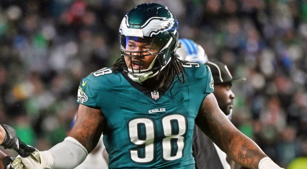 Jalen Carter looking on.