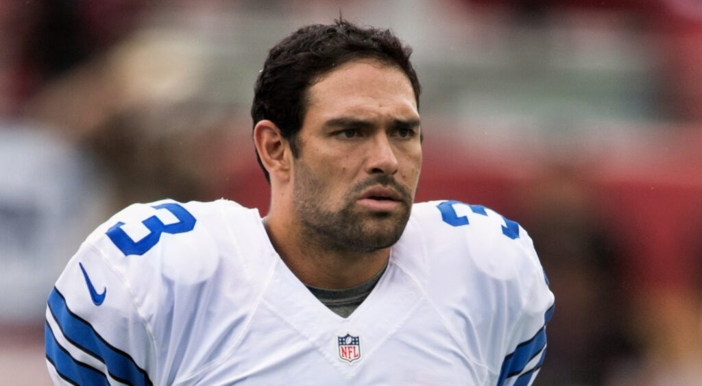 Mark Sanchez looking on.