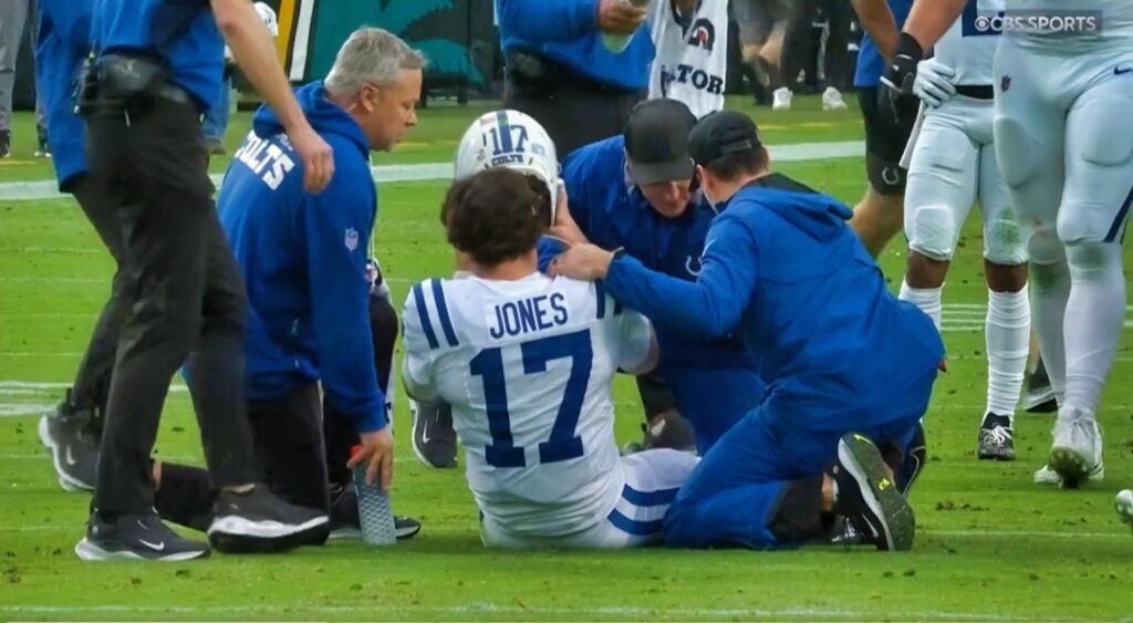 Daniel Jones getting looked at by trainers.