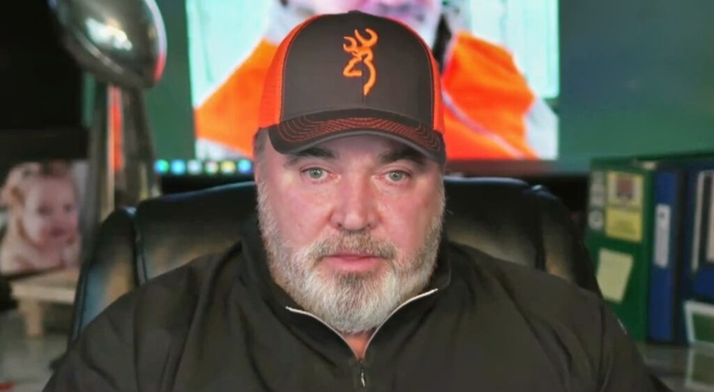 Mike McCarthy looking on.