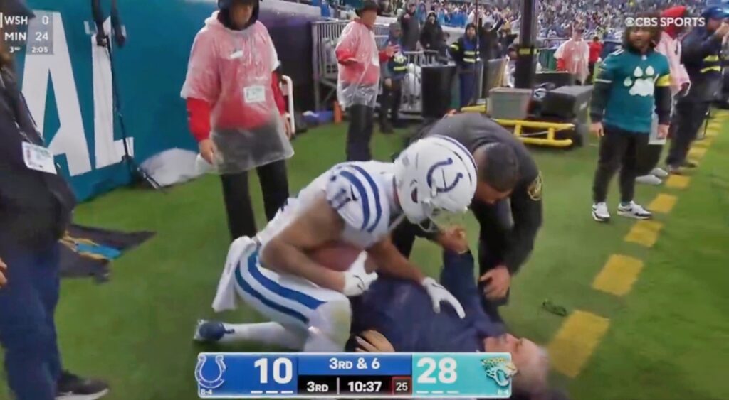 Sideline worker KO'd and Michael Pittman (Photo via CBS)