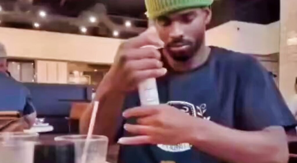 Shedeur Sanders eating at a restaurant. 